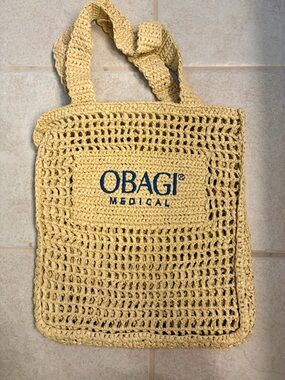 Obagi Crochet Tote Bag in Pale Yellow with Blue Logo